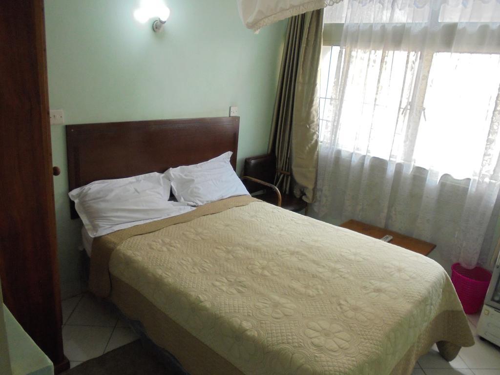 Karibu Hotel Найроби Номер фото
